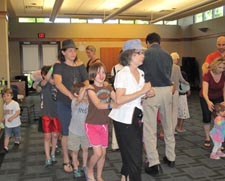 Gari Stein with a crowd of parents and children